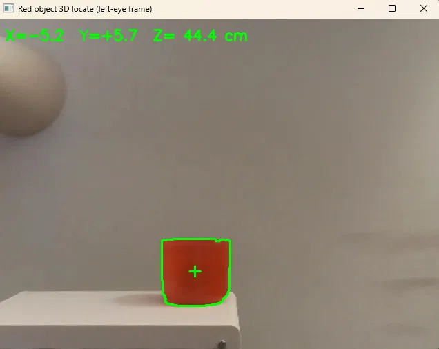 Detection software outlining a red cup and reporting its 3D position in centimeters